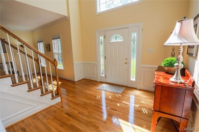 Enter the Sunny 2 story foyer with custom doors, w