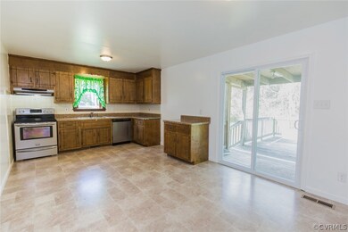 Kitchen with Stainless Steel appliances, new laminate floors.  Opens to the back deck.