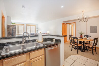 The open design of the kitchen allows for seamless