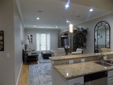 Entry with Kitchen to the left which is open to th