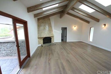 Family room next to kitchen with vaulted ceiling a
