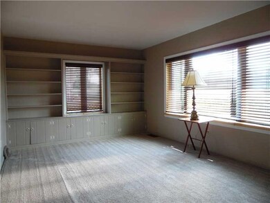 Living Room. Built in storage and bookcases add to