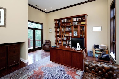 Doors open to the deck from the beautiful office.  Bookcase is built-in.