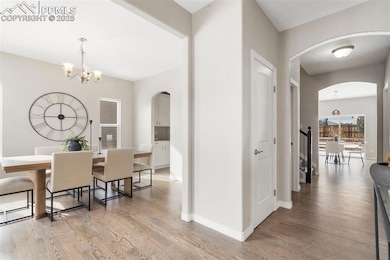 Dining room with wood-type flooring and a notable 