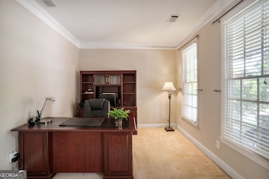 To the right upon entry, a versatile room awaits ideal for a home office, formal living area, or creative space to suit your needs