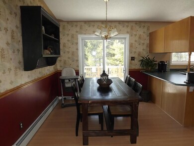 Dining area off the kitchen. Sliding...