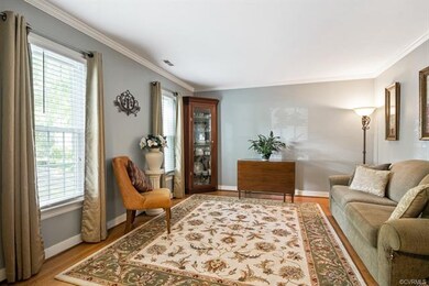 Formal living room has quiet elegance with hardwoo
