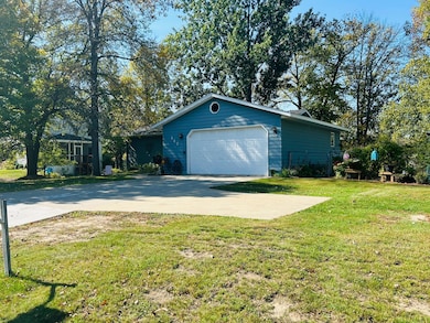 Cement driveway w/extra parking pad
