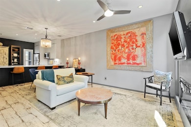 Family room features canned lighting, distressed w