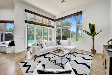 Huge floor-to-ceiling windows flank the family roo
