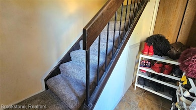 Stairs featuring baseboards