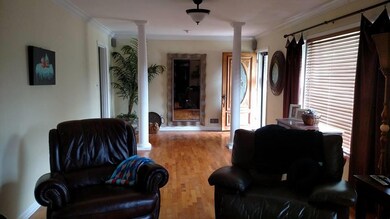 Living room looking toward the front door. 