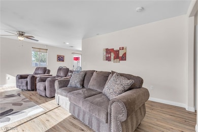 Living area with recessed lighting, wood finished
