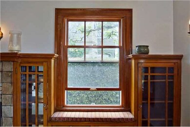 Pella wooden double-hung windows above the window 
