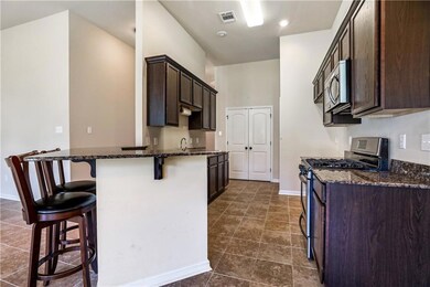 High ceilings throughout! Wrap around bar, stainle