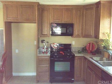 View #3 of kitchen with new stove.