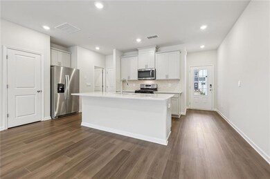 Kitchen with visible vents, a sink, tasteful backs