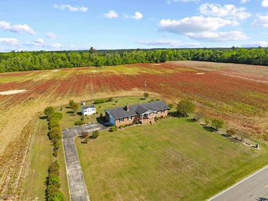 Birds eye view of property featuring a rural view