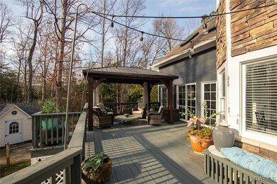 Deck with a gazebo, a storage unit, outdoor lounge