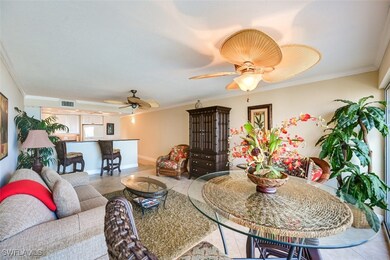 Tiled living room with ceiling fan and ornamental