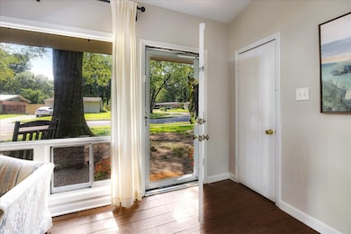 Entryway with wood finished floors and baseboards