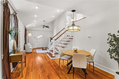 Dining area with vaulted ceilings open to the kitchen and living room
