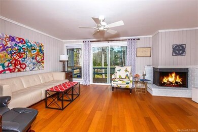 Spacious Living Room with Fireplace & view of Lake