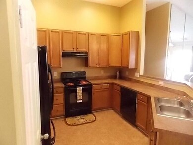 Kitchen with updated appliances, cabinet space and pantry.