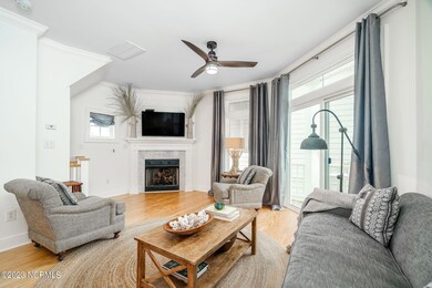 Open living room w/ fireplace