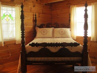 Master Bedroom: Nice master with antique stained g