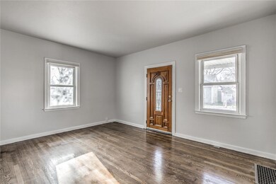 Family room with beautiful hardwood floors.