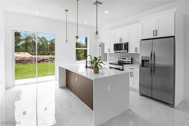 Kitchen with appliances with stainless steel finis