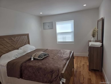 Bedroom featuring light wood finished floors and recessed lighting