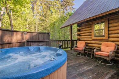 Back deck boasts of hot tub and sitting areas