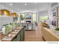 Kitchen with pendant lighting, a fireplace, wood finished floors, recessed lighting, and dishwasher