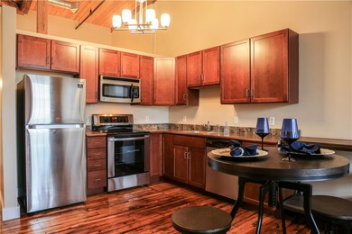The kitchen boasts a new refrigerator and range.