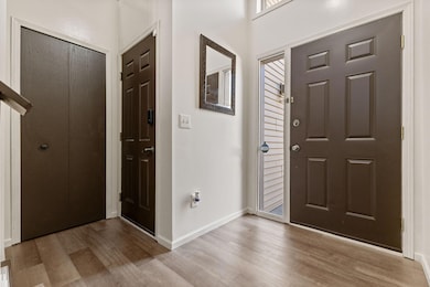 The spacious entryway has loads of natural light coming through the big windows!