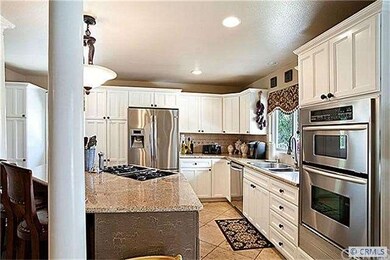 Open Kitchen with stainless steel appliances ,isla