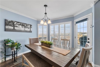 So much light! Dining area has chandelier, angled 