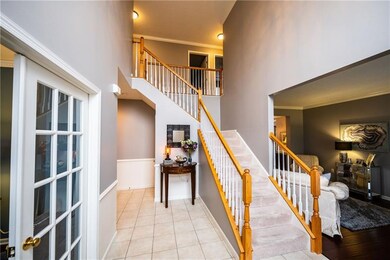 2 Story foyer with beautiful chandelier. Two tone 
