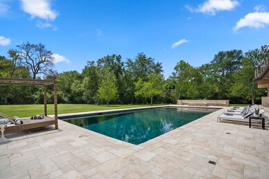 The outdoor oasis features resort style pool w/ a