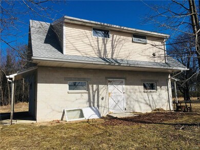 Two Story Outbuilding w/ side garage bay