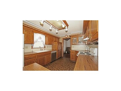 Large kitchen with pantry and loads of cabinets is