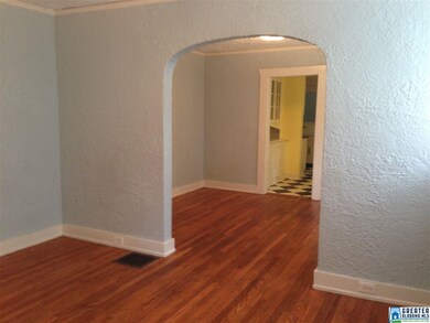 The beautiful arched doorway between the living ro