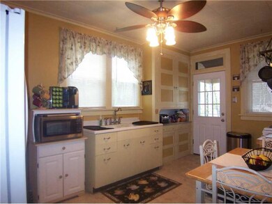 Kitchen. Eat in kitchen with original built-ins.