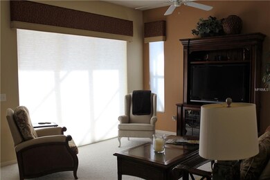 Family room open to kitchen.  Keep the shades down
