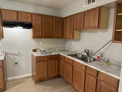 Kitchen with light hardwood / wood-style flooring,