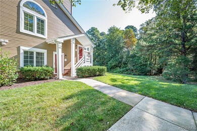 The property backs to a grassy and wooded area. It