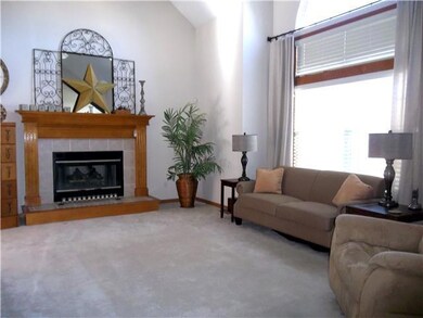 Great Room features carpet and ceiling fan.