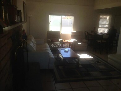 Property Photo. Entry way to kitchen from living r